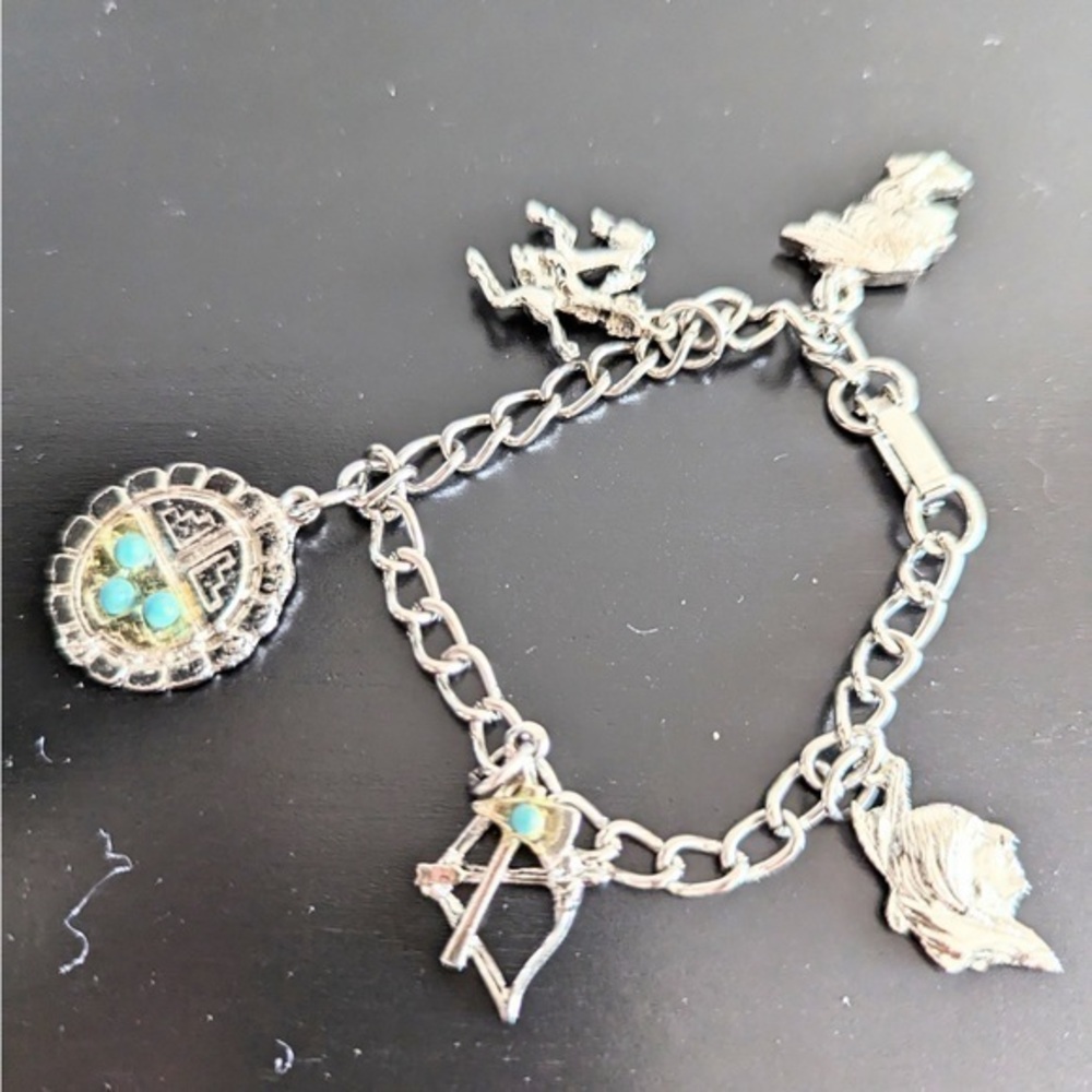 Silver tone with turquoise colored accents charm bracelet